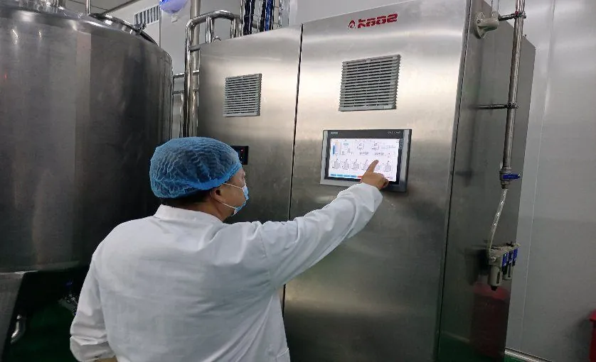 Operator monitoring the sterilisation control panel